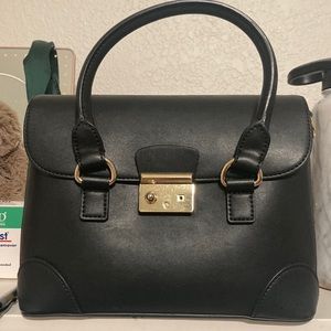 Black purse with gold details
